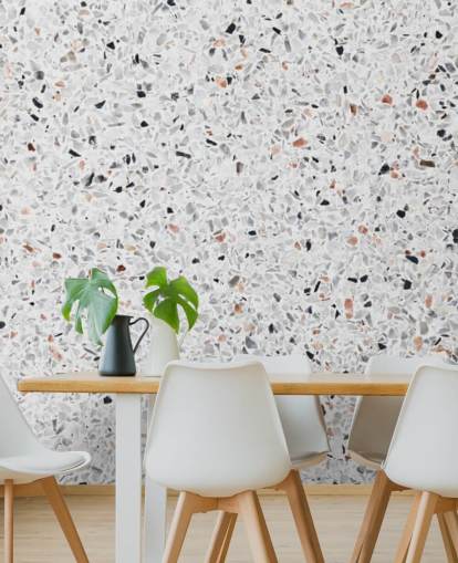 Papel pintado terrazo gris y negro moteado y terracota