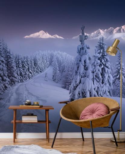 snowy forest and piste with mountains in the distance wallpaper