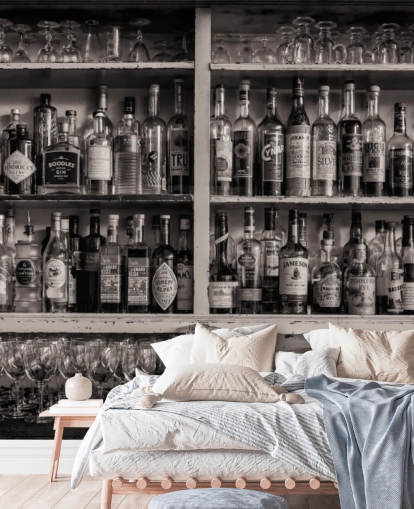 black and white bottles on shelf behind a bar wallpaper