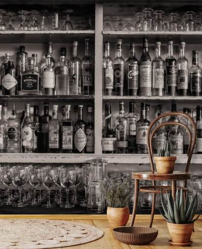 black and white bottles on shelf behind a bar wallpaper