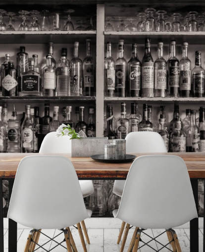 black and white bottles on shelf behind a bar wallpaper