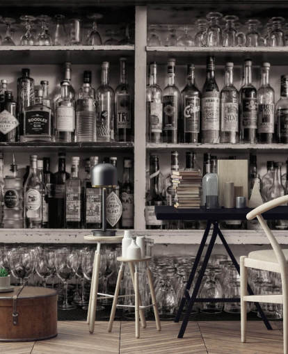 black and white bottles on shelf behind a bar wallpaper