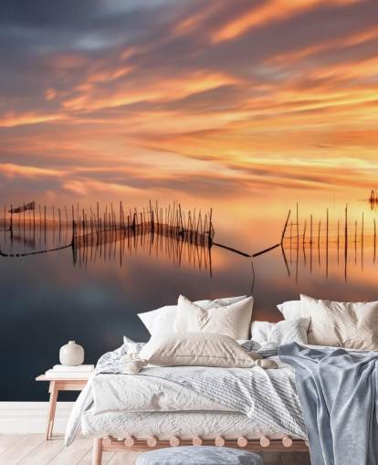 siluetas de red en el océano contra fondo de pantalla de cielo al atardecer