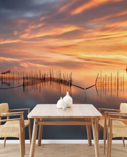 fishnet silhouettes in ocean against sunset sky wallpaper