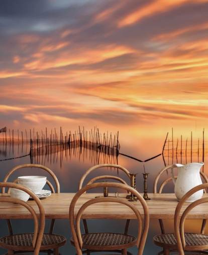 fishnet silhouettes in ocean against sunset sky wallpaper