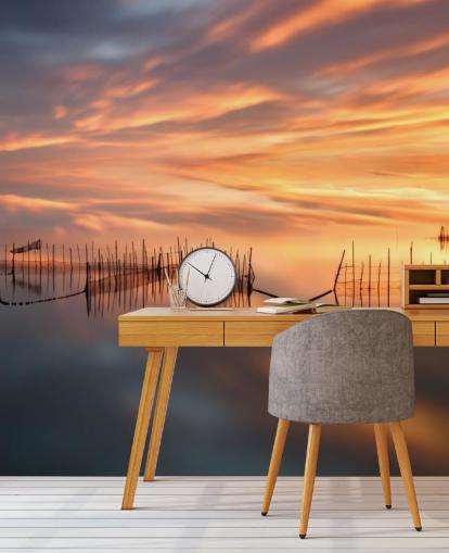 fishnet silhouettes in ocean against sunset sky wallpaper