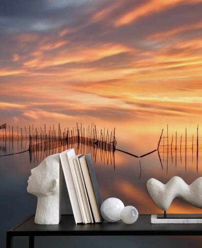 fishnet silhouettes in ocean against sunset sky wallpaper