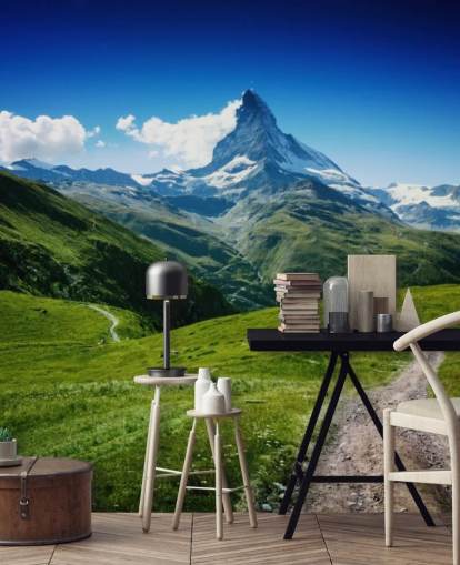 snowy peak of mountain above lush green field wallpaper