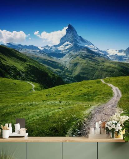 snowy peak of mountain above lush green field wallpaper