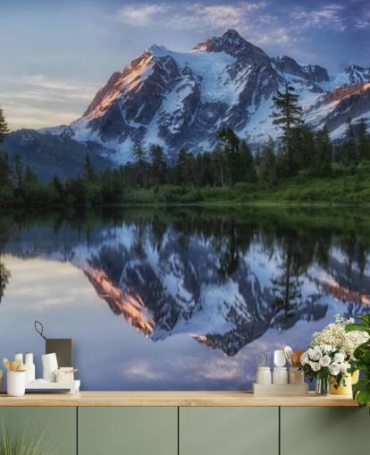 snowy mountain and lake waters wallpaper