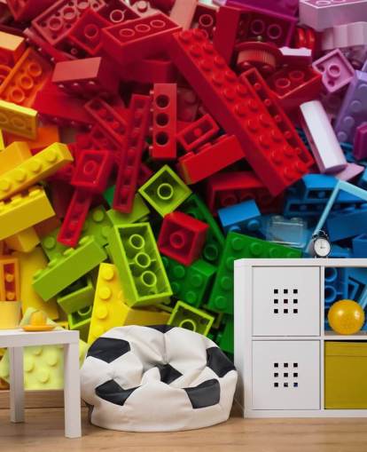 tijolos de brinquedo coloridos em uma pilha de papel de parede infantil