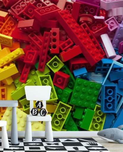 tijolos de brinquedo coloridos em uma pilha de papel de parede infantil