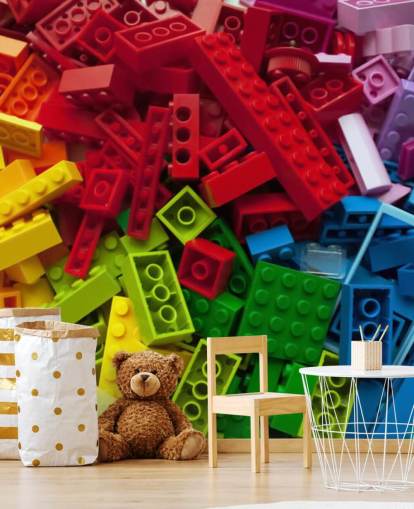 tijolos de brinquedo coloridos em uma pilha de papel de parede infantil