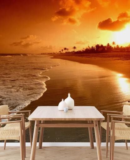 Fondo de pantalla de atardecer naranja en playa tropical