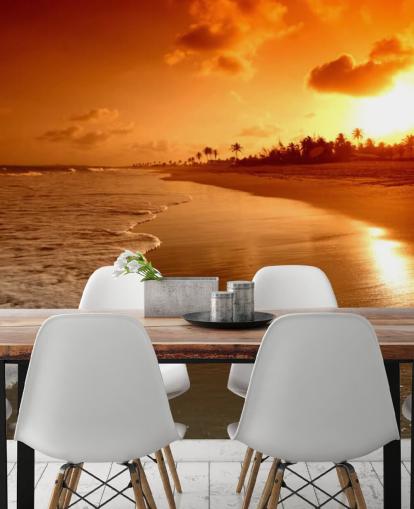 Fondo de pantalla de atardecer naranja en playa tropical