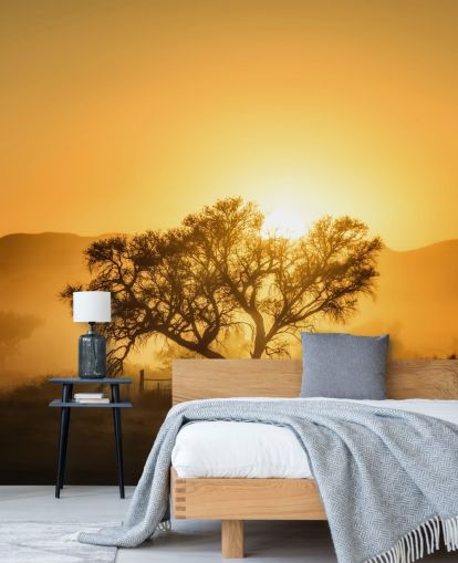 Goldener Sonnenaufgang gegen Baum-Tapete