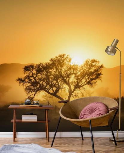 Papel pintado Amanecer dorado contra el árbol