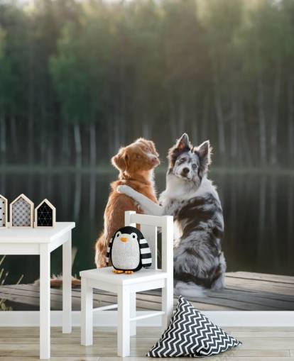 dos perros sentados junto a un lago con los brazos alrededor del otro mural