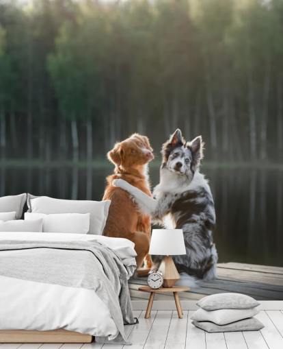dois cães sentados à beira de um lago com os braços em volta um do outro mural
