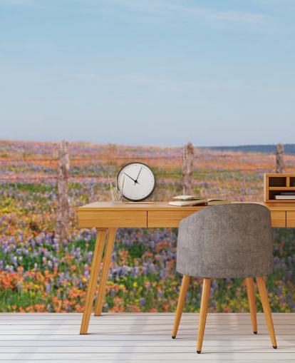 meadow field with orange, purple and yellow flowers wallpaper