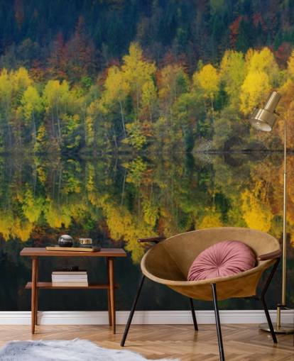 orange autumnal trees by a lake reflecting their image wallpaper
