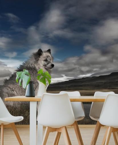 fondo de pantalla de perro peludo grande gris sentado junto a un río