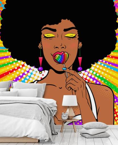 girl with afro sucking rainbow heart shaped lolly on rainbow coloured background wallpaper