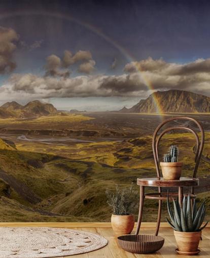 Regenbogen über hügeliger Landschaft Tapete