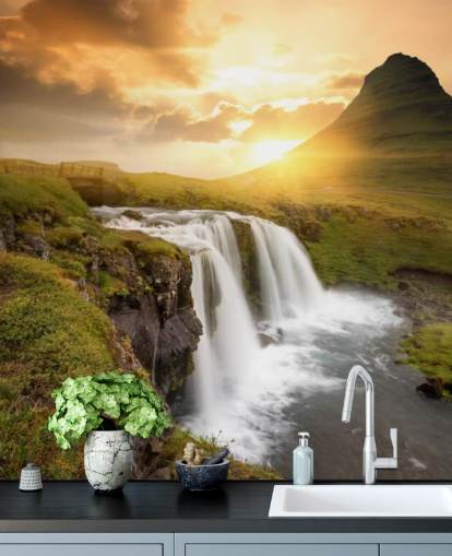 orange and green customizable waterfall wallpaper mural called Icelandic Waterfall Sunset for spas, bedrooms and bathrooms