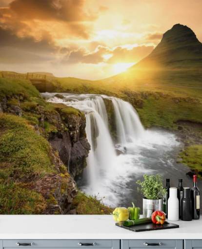 papier peint mural en forme de cascade personnalisable orange et vert appelé Icelandic Waterfall Sunset pour les spas, les chambres et les salles de bains