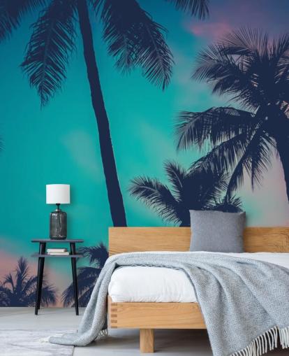 zwarte palmboomsilhouetten tegen blauwe, roze en oranje luchten behang