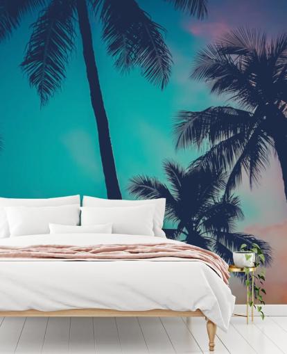 black palm tree silhouettes against blue, pink and orange skies wallpaper