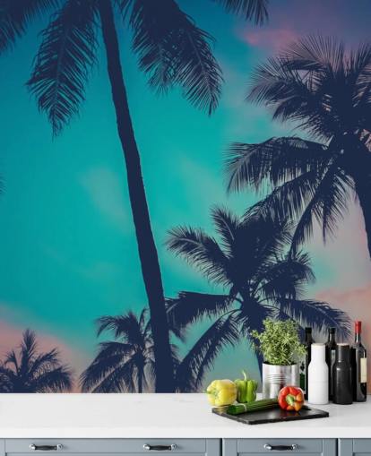 black palm tree silhouettes against blue, pink and orange skies wallpaper