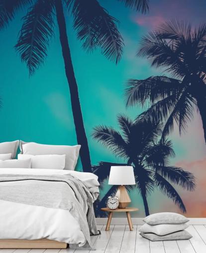 black palm tree silhouettes against blue, pink and orange skies wallpaper