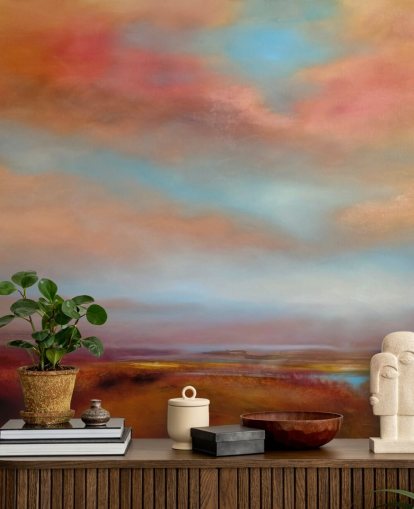 orange and red clouds amongst blue sky over pink heathland painting wallpaper