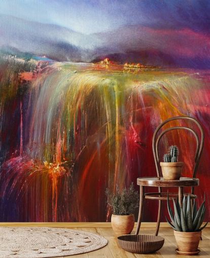 abstract painting of overflowing colour in reds, oranges, pinks, purples wallpaper