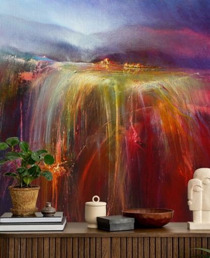 abstract painting of overflowing colour in reds, oranges, pinks, purples wallpaper