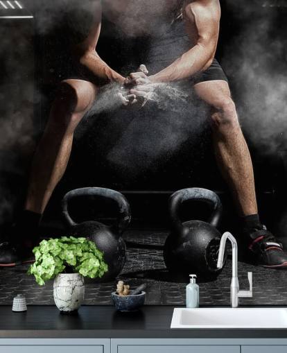 man putting chalk on hands before lifting weights wallpaper