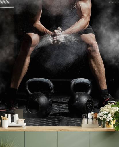 man putting chalk on hands before lifting weights wallpaper