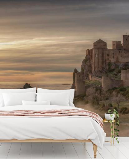 spanish castle on mountaintop above mist mountains wallpaper