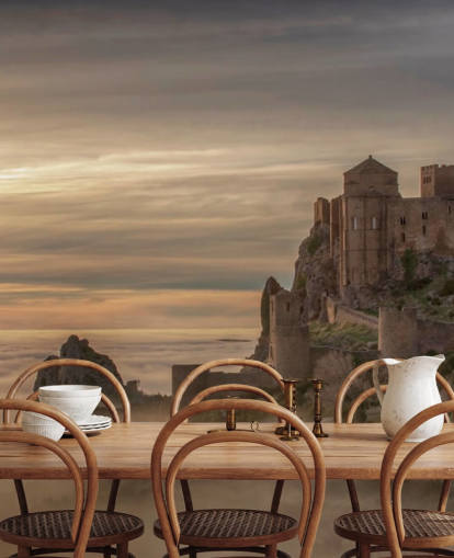 castillo español en la cima de la montaña encima de las montañas de niebla