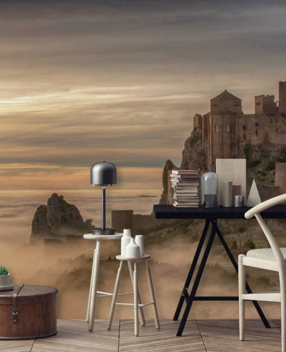 spanish castle on mountaintop above mist mountains wallpaper