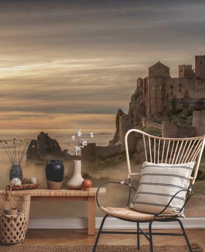 spanish castle on mountaintop above mist mountains wallpaper