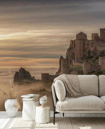 spanish castle on mountaintop above mist mountains wallpaper