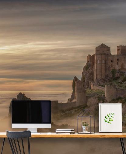 spanish castle on mountaintop above mist mountains wallpaper