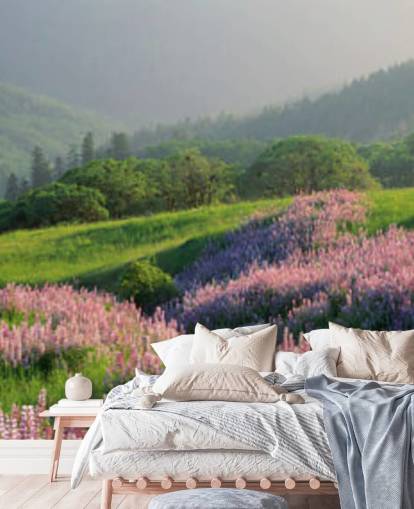 light purple and pink wild flowers in field with green hills wallpaper
