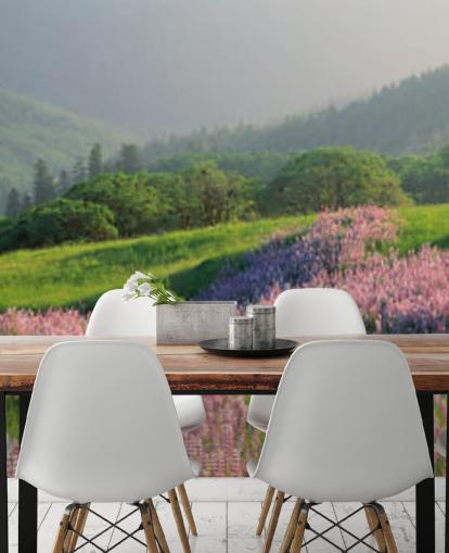 light purple and pink wild flowers in field with green hills wallpaper