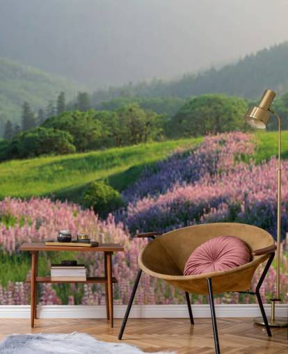 light purple and pink wild flowers in field with green hills wallpaper