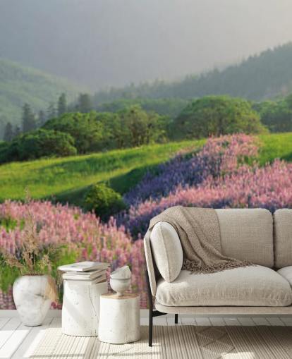 light purple and pink wild flowers in field with green hills wallpaper