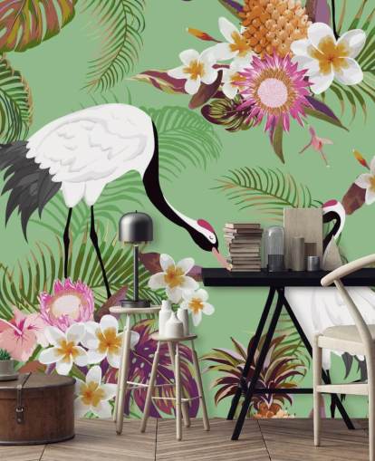 due gru con fogliame tropicale e sfondo verde